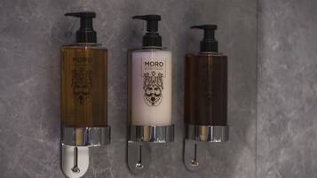Three Morro branded dispensers mounted on a wall.