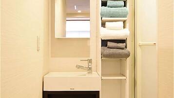 Shower, free toiletries, slippers