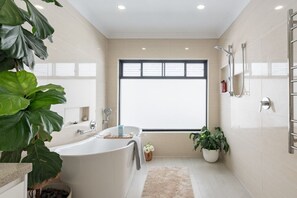 Bathtub, hair dryer, towels, soap