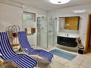 Shower, hair dryer, towels, toilet paper