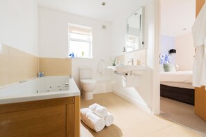 Hair dryer, towels, shampoo, toilet paper