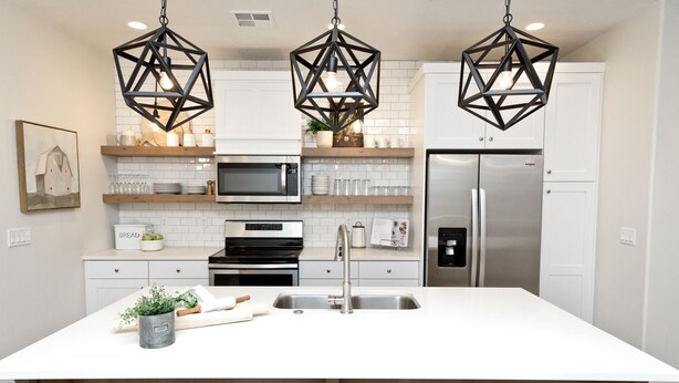 A modern kitchen with white cabinetry, a central island, a stainless steel refrigerator, and geometric pendant lights. - 🐄The Farm House 🐄 POOL IS OPEN!!! (Washington)