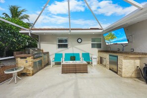 House, Multiple Beds (Cozy home with sunroom, pool and step) | Terrace/patio