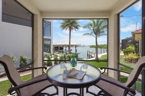 House, Multiple Beds (Unique waterfront home with pool, spa) | Outdoor dining