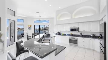 House, Multiple Beds (Waterfront home on key lot with pool,) | Private kitchen | Fridge, microwave, oven, stovetop