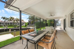 House, Multiple Beds (Pet-friendly waterside home with pool) | Outdoor dining