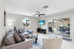 House, Multiple Beds (Idyllic waterfront home with pool and) | Living area
