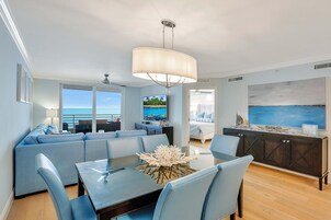 Condo, Multiple Beds (Beachfront condo with 180-degree view) | Living room | Flat-screen TV