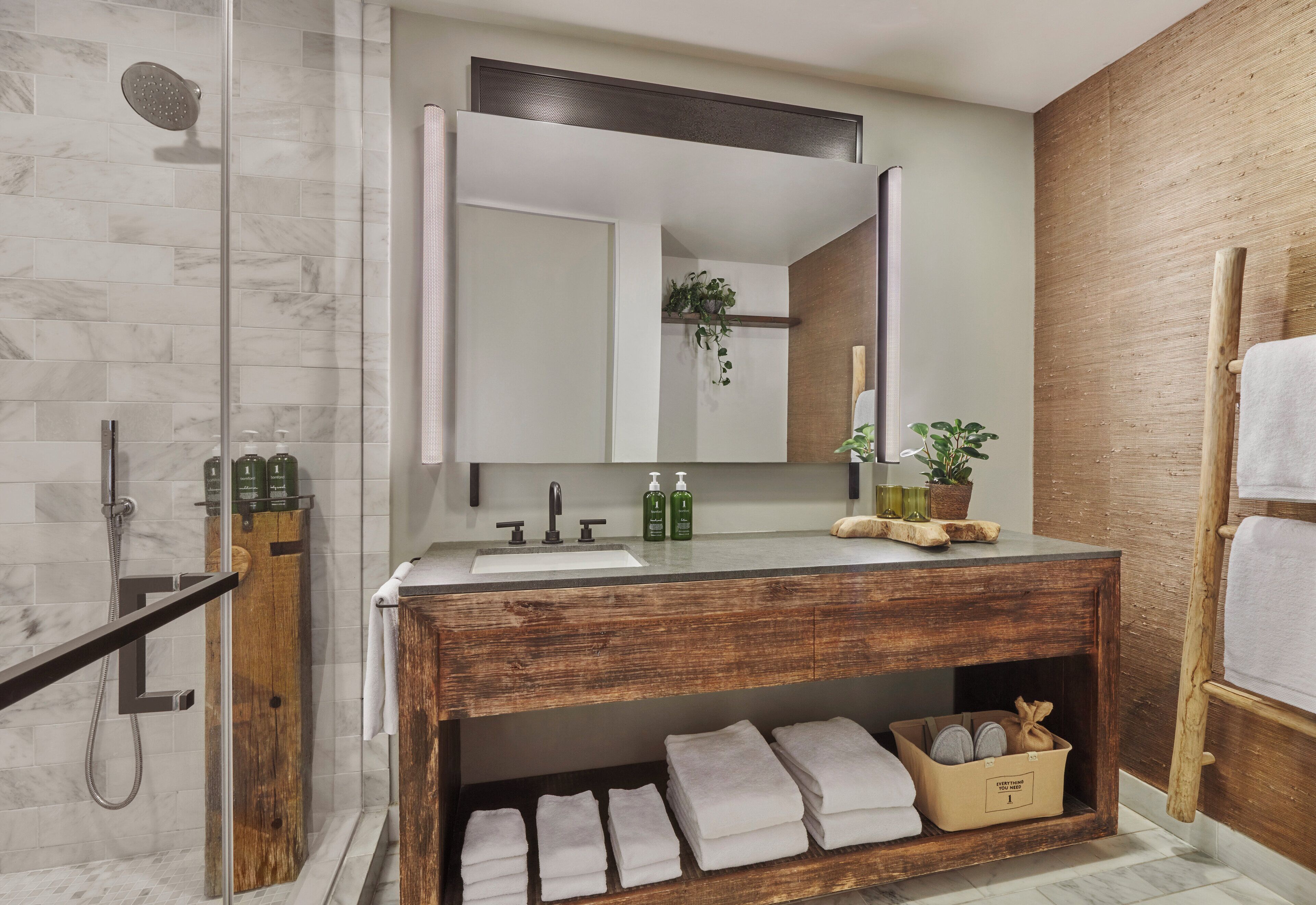 deep-soaking bathtub, designer toiletries, hair dryer, bathrobes