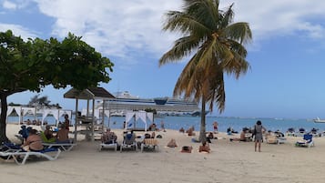 On the beach, sun-loungers, beach towels