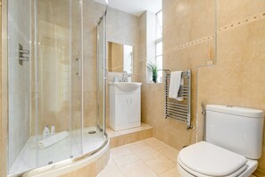Shower, hair dryer, towels, shampoo