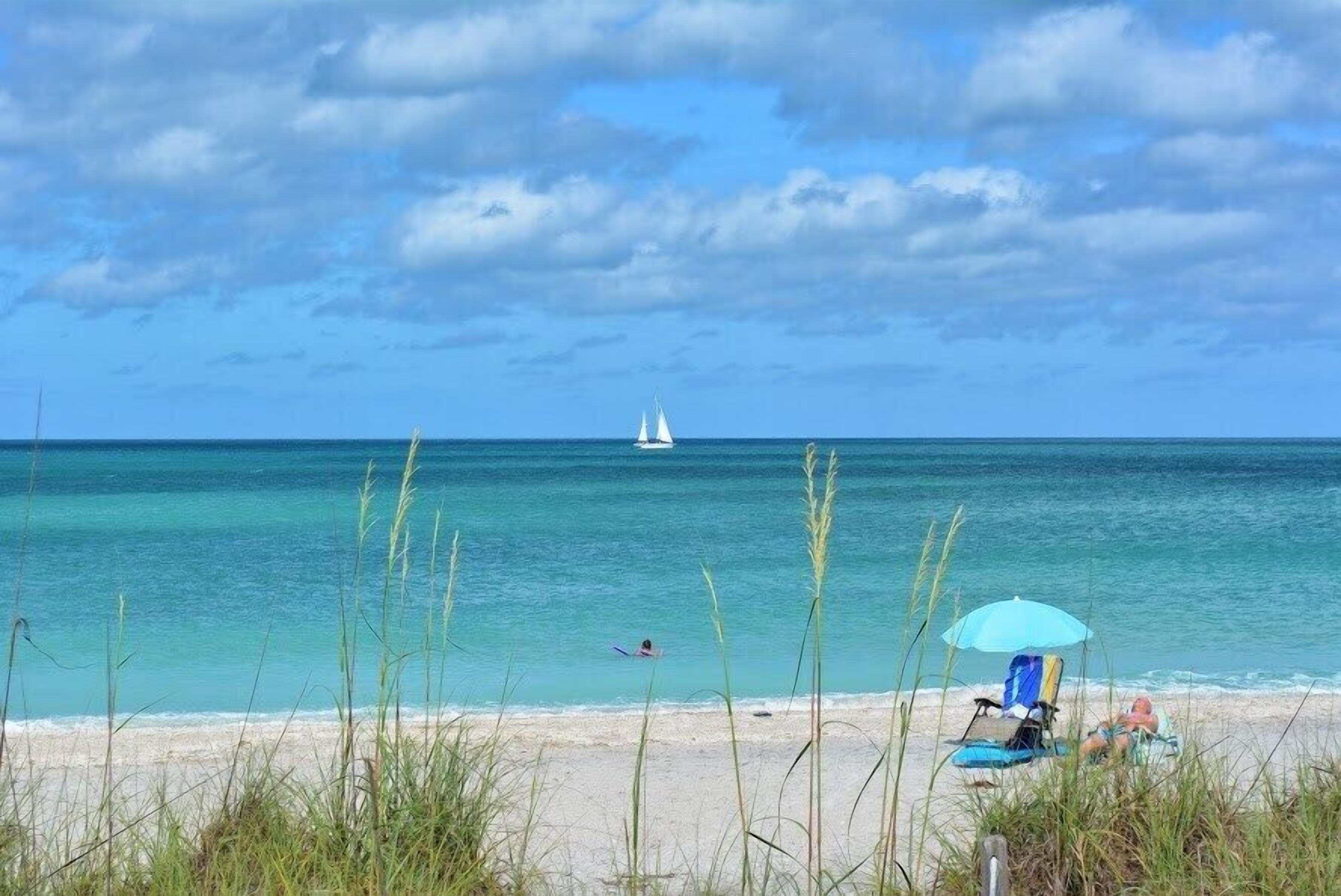 On the beach, sun loungers, beach towels