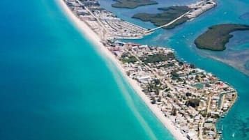 On the beach, sun loungers, beach towels