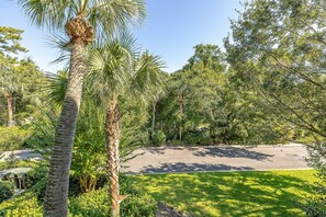 Surrounded by lush trees, this serene outdoor space offers a peaceful retreat.