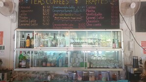 A menu board for teas, coffees, and frappes with prices listed. - Bohemiaz Resort and Spa (Kampot)