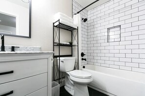 Bathtub, hair dryer, towels