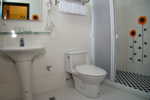 A bathroom with a sink, toilet, and glass shower enclosure. - Ruisui 38 Homestay (Ruisui)