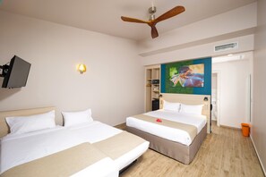 Comfort Quadruple Room | Premium bedding, in-room safe, individually decorated