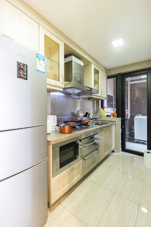 Apartment, 2 Bedrooms | Private kitchen | Fridge, stovetop, electric kettle, cookware/dishes/utensils