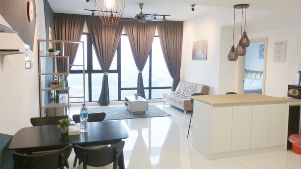 A modern kitchen with a dining area, large windows with curtains, and a view of the city. - South Key Mosaic (Johor Bahru)