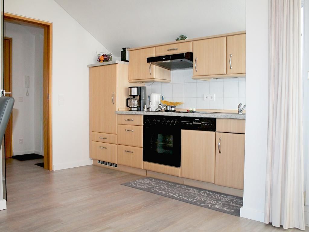 Een koelkast, een oven, een vaatwasser, een koffiezetapparaat/waterkoker