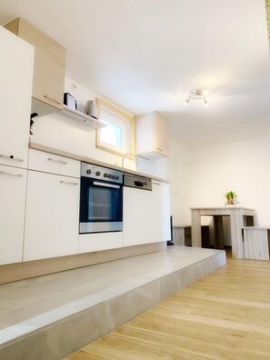 Deluxe Apartment, 2 Bedrooms | Private kitchen | Fridge, oven, stovetop, dishwasher