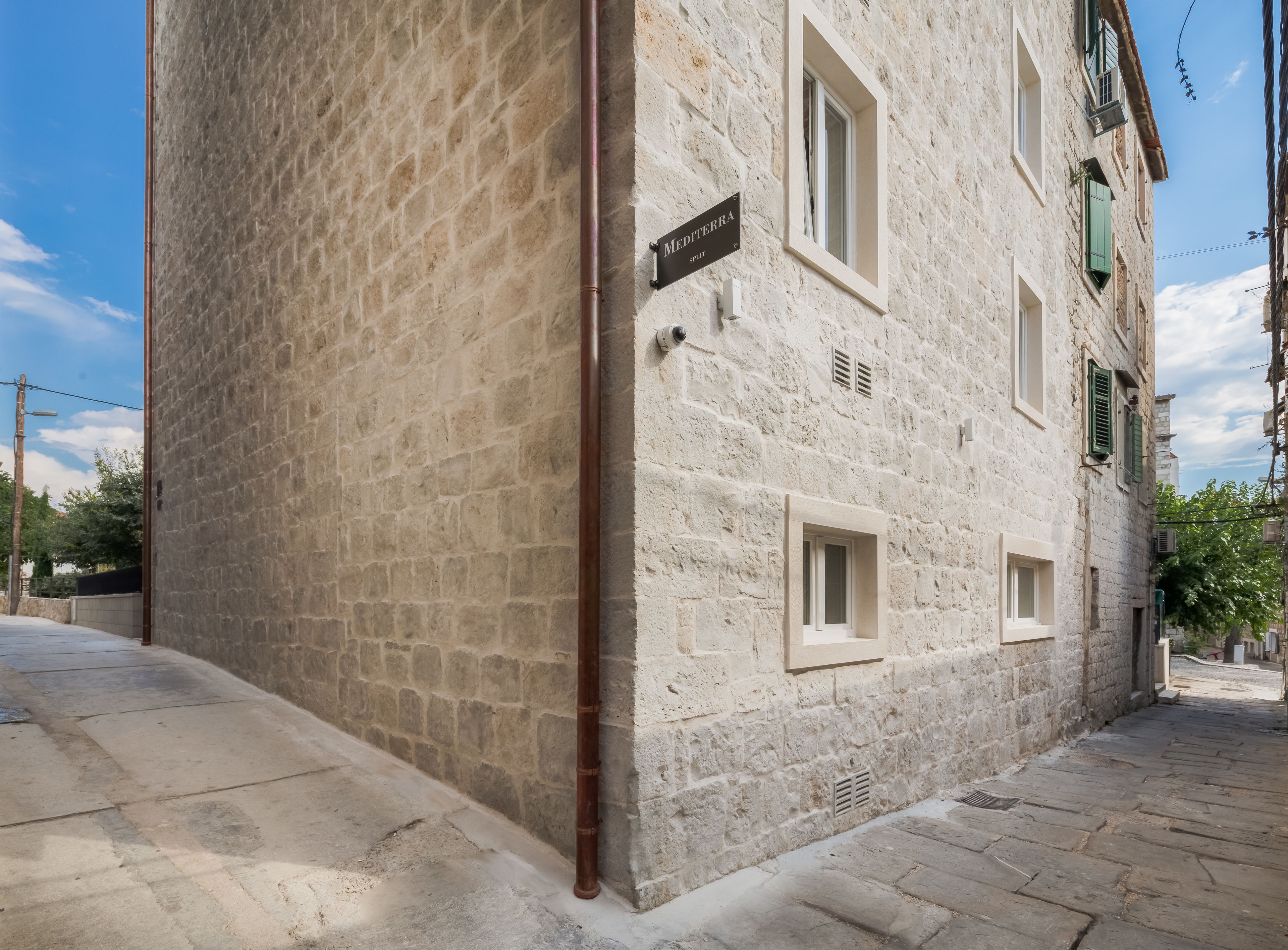A stone building with a sign reading "Mediterranea Split."