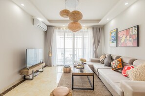 Apartment, 3 Bedrooms | Living room | Flat-screen TV