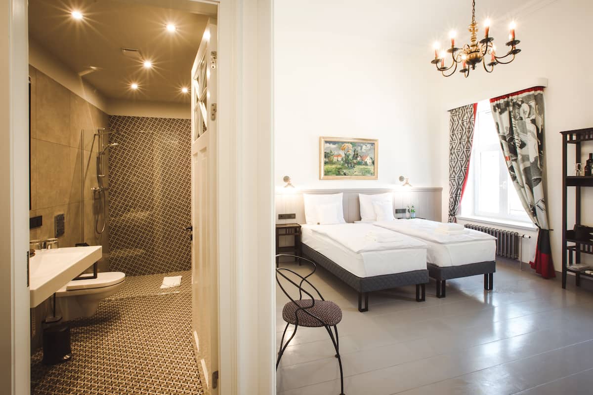 Junior Double or Twin Room | Minibar, in-room safe, individually decorated, individually furnished