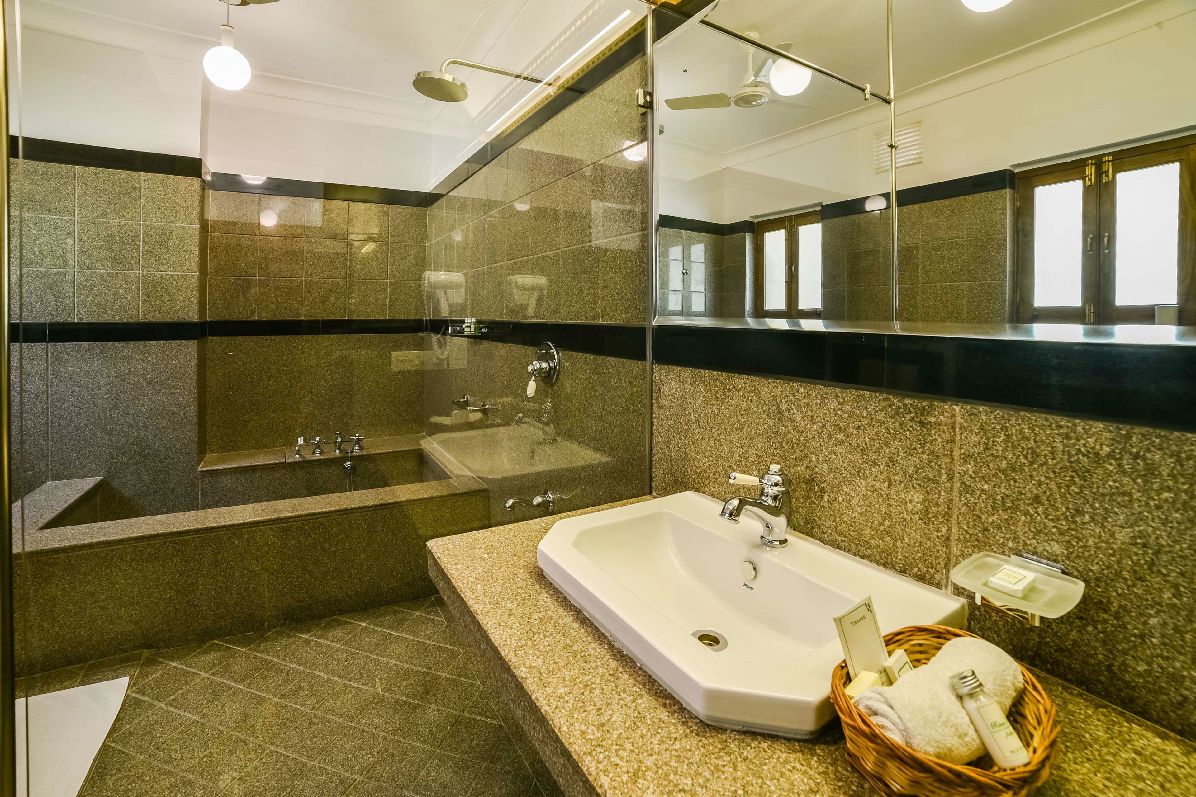 superior double room | bathroom | deep-soaking bathtub, rainfall showerhead, free toiletries, hair dryer