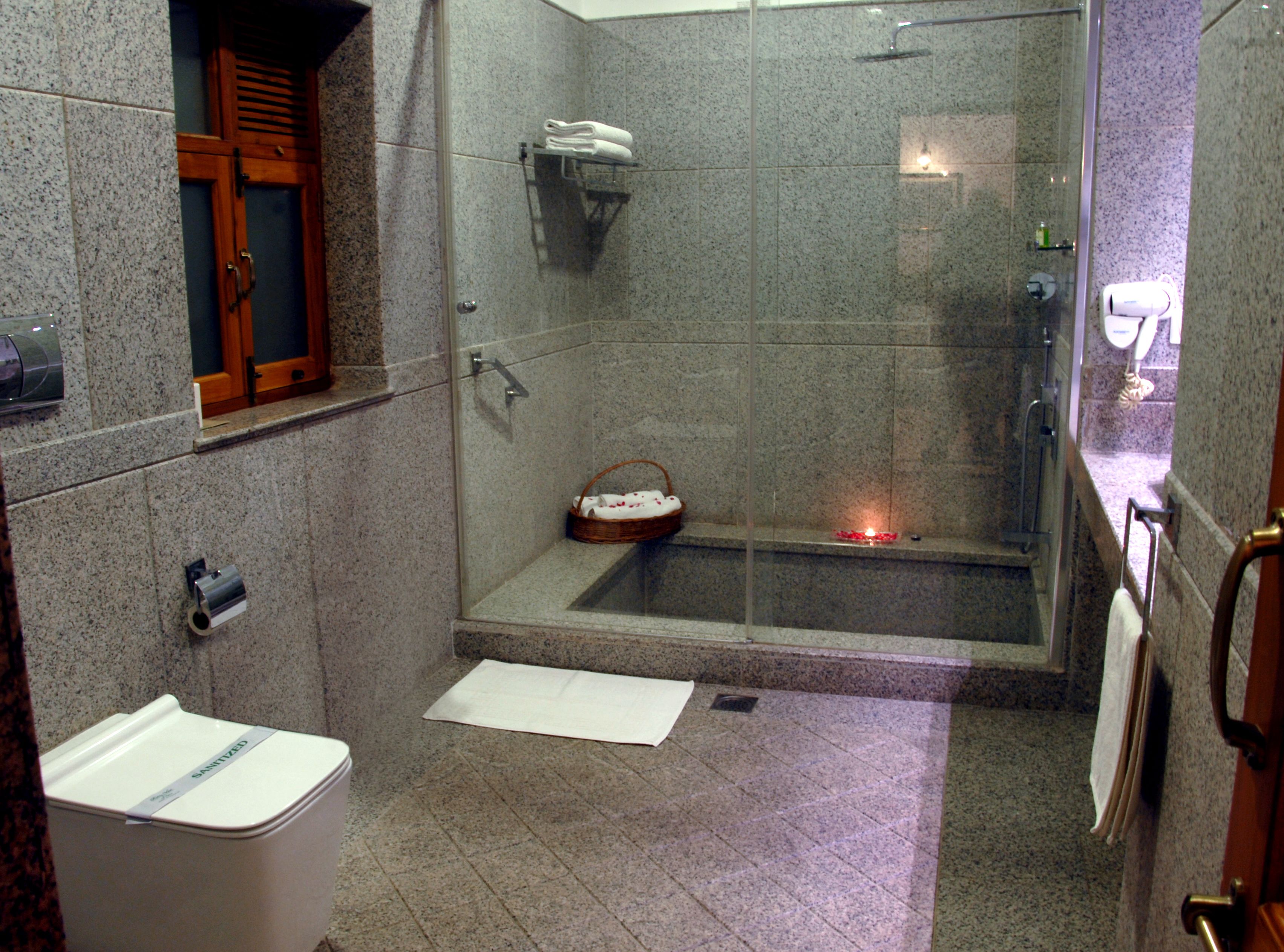 premium double room | bathroom | deep-soaking bathtub, rainfall showerhead, free toiletries, hair dryer