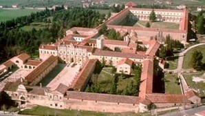 An aerial view of a historic monastery complex with multiple buildings, including a large central structure with a square courtyard, surrounded by smaller buildings and cloisters. - B&B Kalimaka (San Giovanni a Piro)