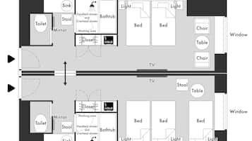 A floor plan of a hotel room with a bathroom, two beds, a TV, a table, a chair, and a window.