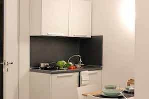 Deluxe Room (Scirocco) | Private kitchen | Full-size fridge, stovetop, espresso maker, coffee/tea maker
