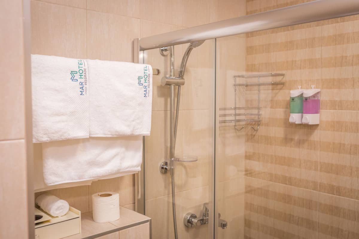 classic single room | bathroom | shower, free toiletries, hair dryer, bathrobes