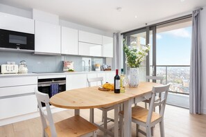 Exclusive Apartment, 2 Double Beds, City View | Private kitchen | Fridge, oven, stovetop, dishwasher