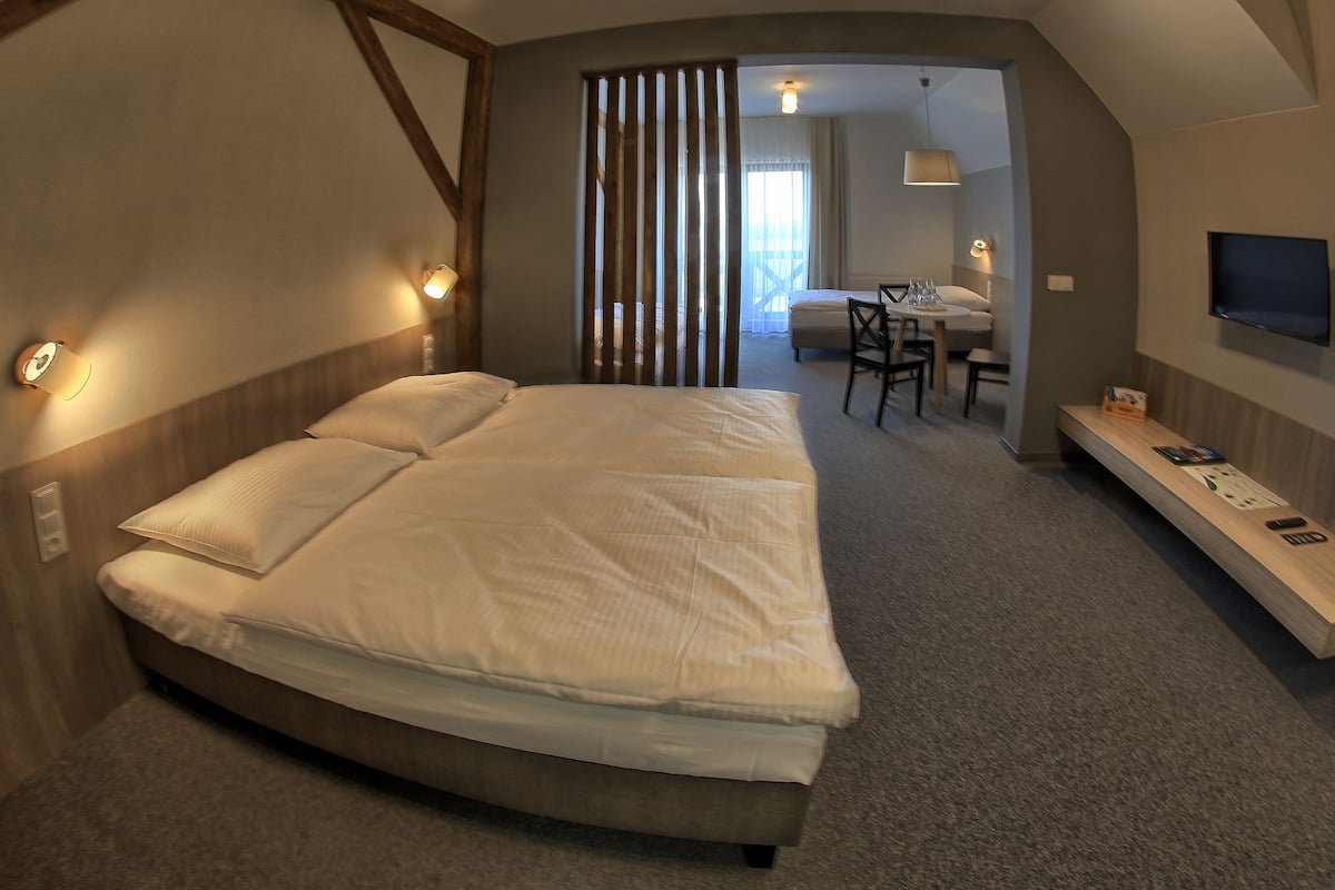 standard quadruple room, multiple beds | in-room safe, desk, blackout curtains, rollaway beds