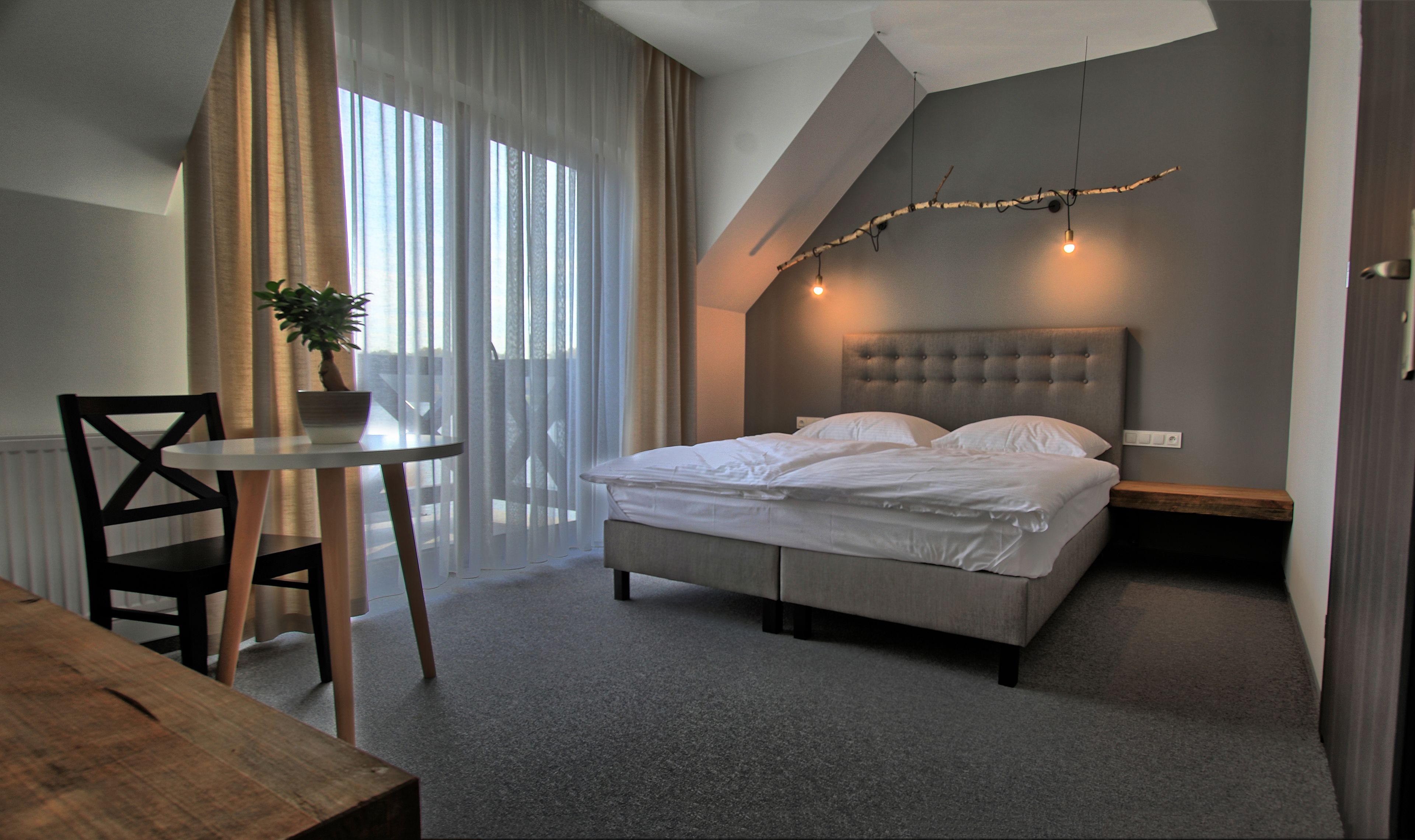 deluxe suite, 1 queen bed, lake view | in-room safe, desk, blackout curtains, rollaway beds