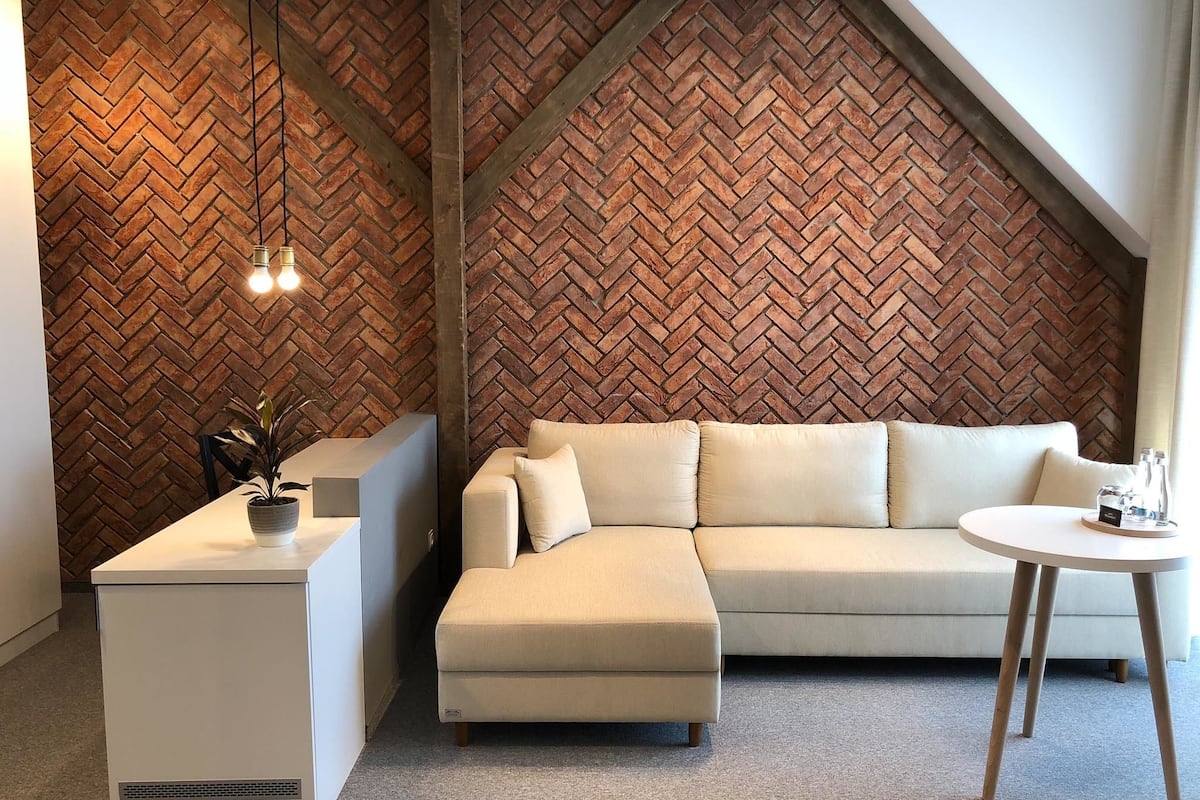 deluxe suite, 1 queen bed, lake view | in-room safe, desk, blackout curtains, rollaway beds