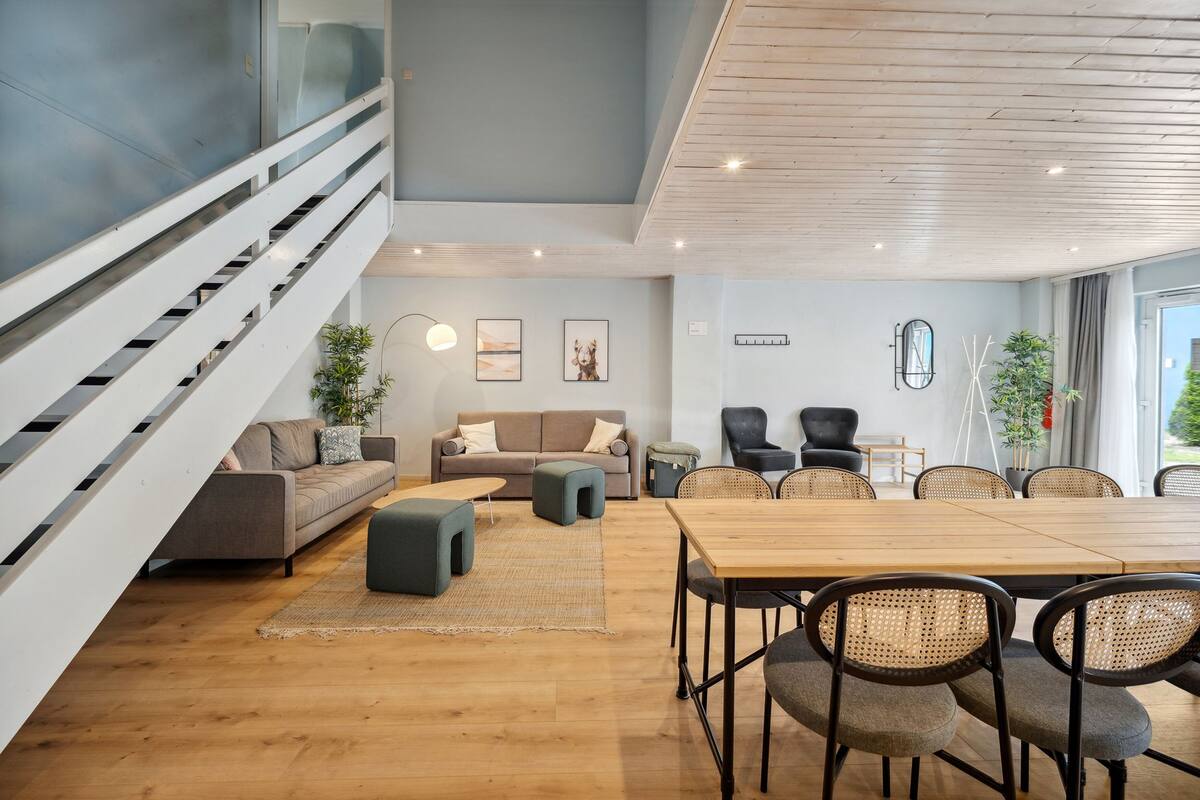 Four-Bedroom Duplex Suite with terrace | Living area | 50-inch Smart TV with satellite channels, TV