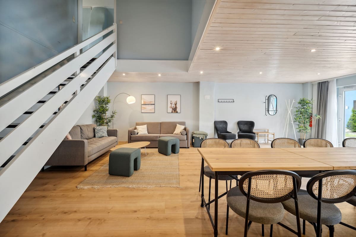 Four-Bedroom Duplex Suite with terrace | Living area | 50-inch Smart TV with satellite channels, TV
