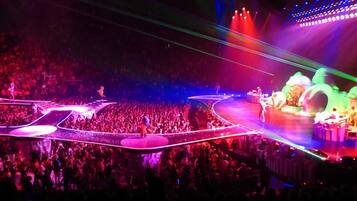 A large indoor venue with a stage and audience.