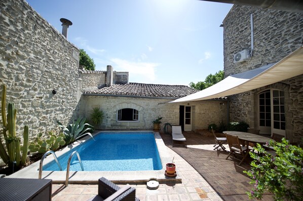 Seasonal outdoor pool, open 10:00 AM to 7:00 PM, sun loungers