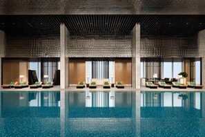 Indoor pool, open 6:00 AM to 10:00 PM, pool umbrellas, pool loungers