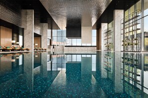 Indoor pool, open 6:00 AM to 10:00 PM, pool umbrellas, pool loungers