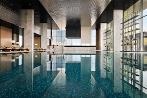 Indoor pool, open 6:00 AM to 10:00 PM, pool umbrellas, pool loungers