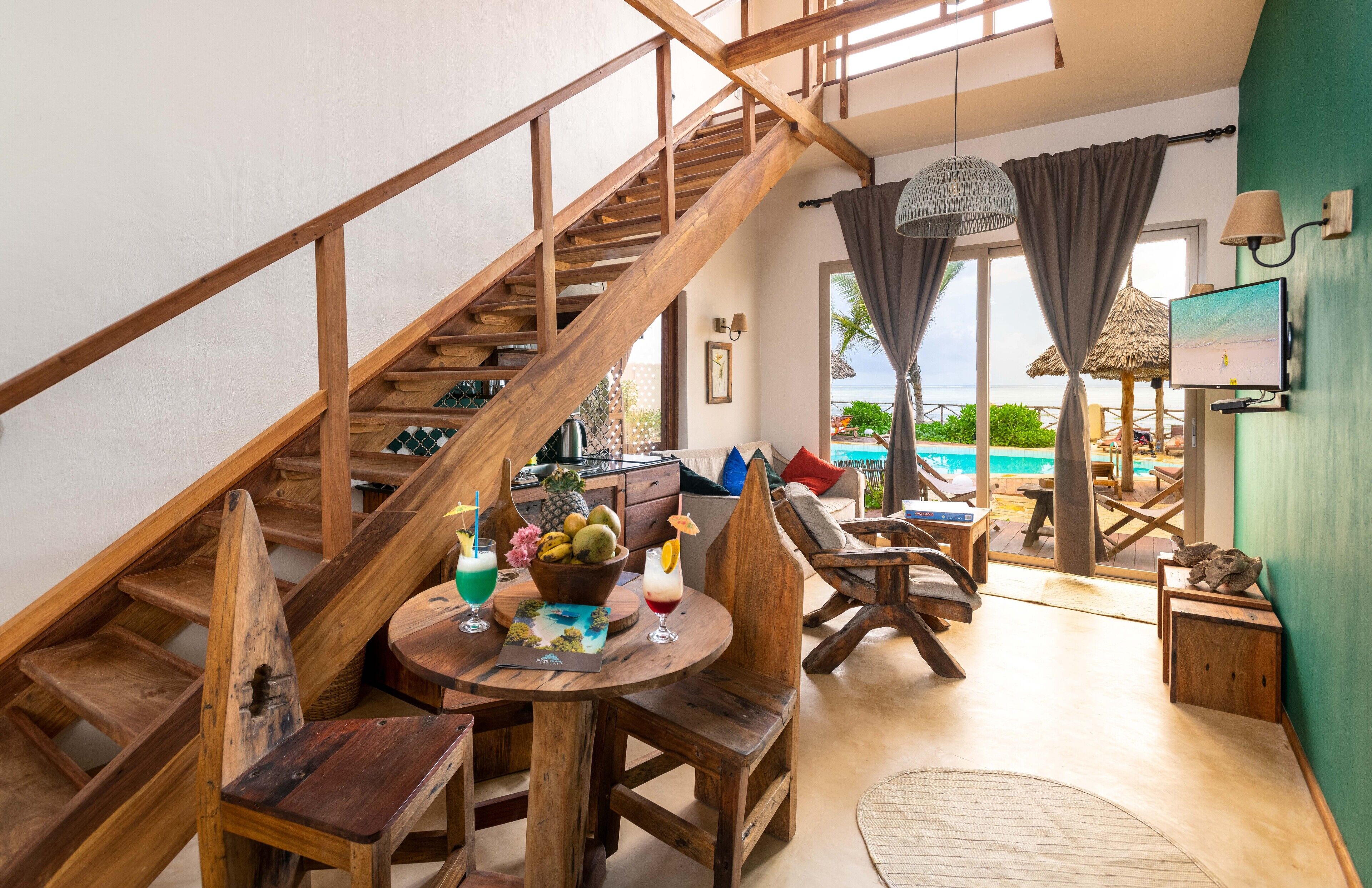 deluxe villa, multiple beds, kitchenette, ocean view | living area | 32-inch led tv with satellite channels, tv