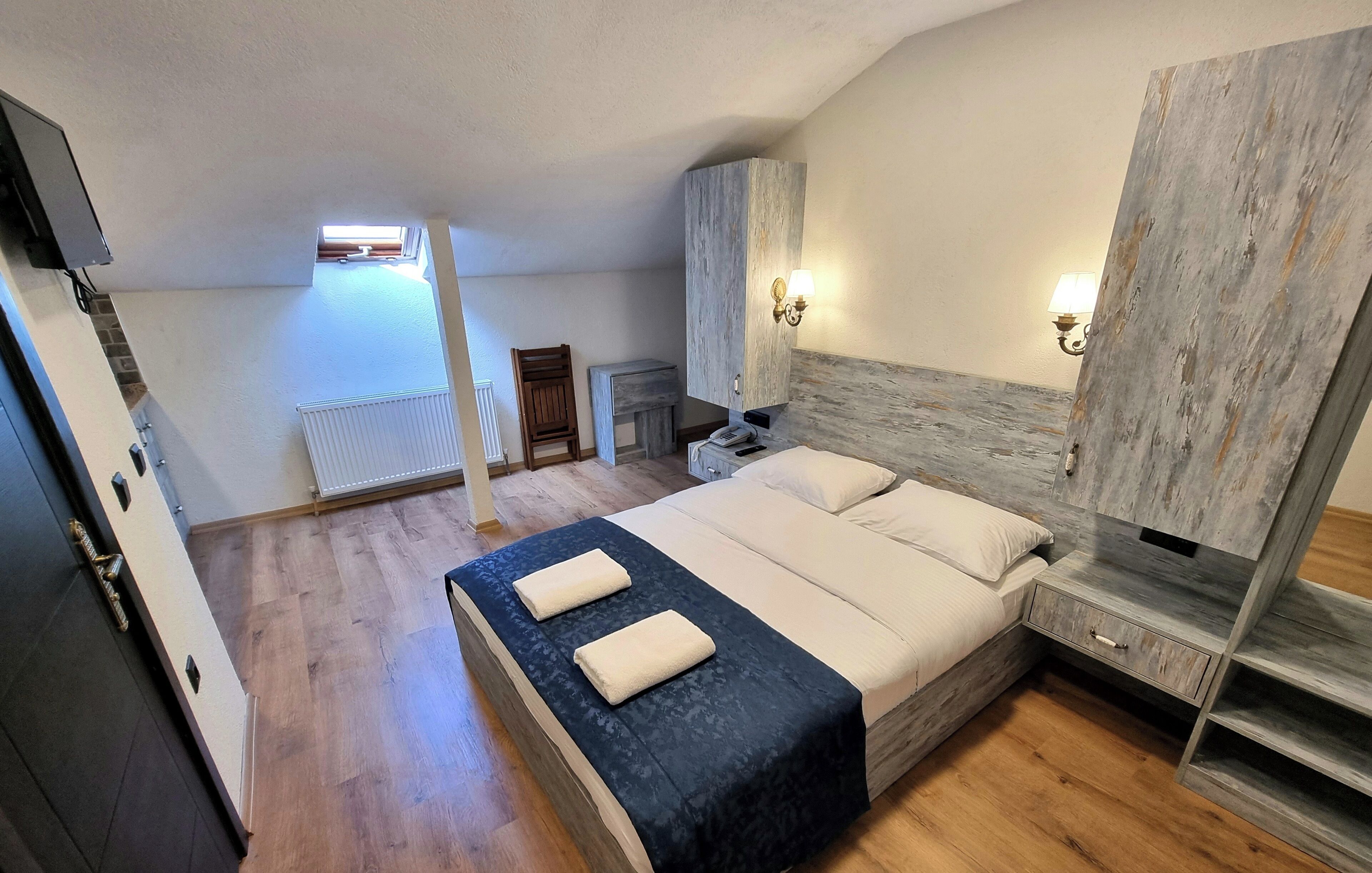 Economy Loft | In-room safe, desk, blackout drapes, iron/ironing board