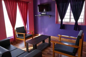 Two Bedroom Villa with Private Lawn | Living area | Flat-screen TV, fireplace