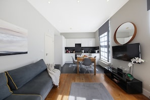 Executive appartement | Woonruimte | Een smart-tv